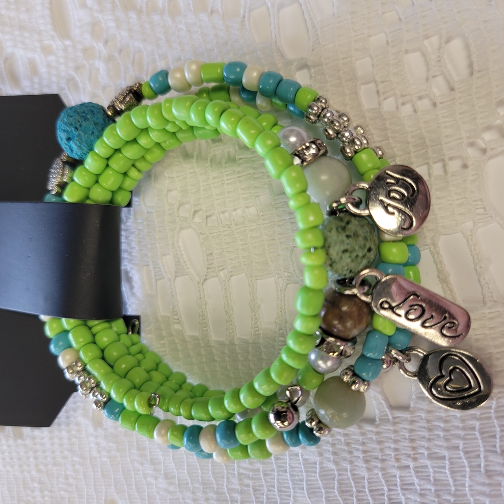 Green Beaded Bracelet with Silver Charms